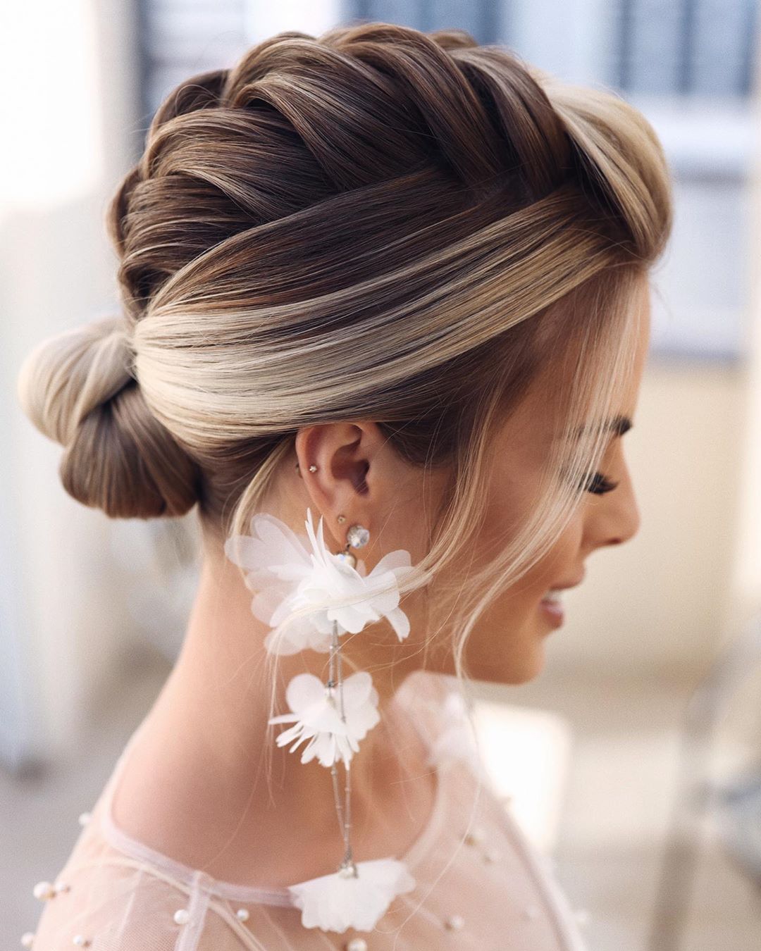 Side View Braided Updo With Face-Framing Pieces Side View Braided Updo With Face-Framing Pieces — Wedding Bun Ideas