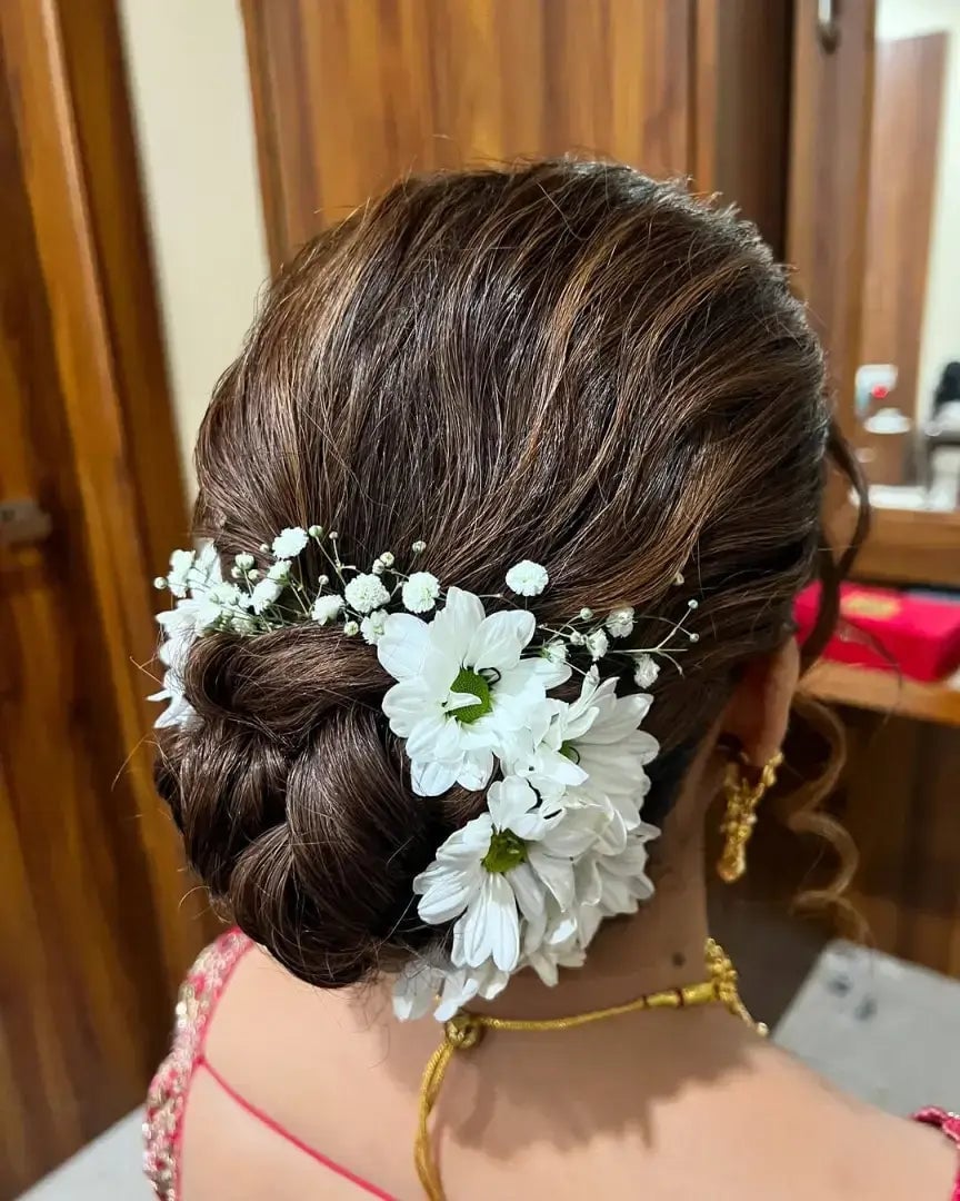 Braided Dark Brown Bun With Flowers Braided Dark Brown Bun With Flowers — Wedding Bun Ideas