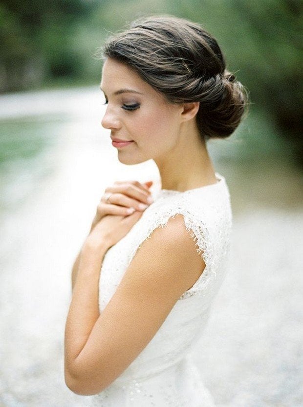 Low Dark Brown Bun With Twisted Sections Low Dark Brown Bun With Twisted Sections — Wedding Bun Ideas