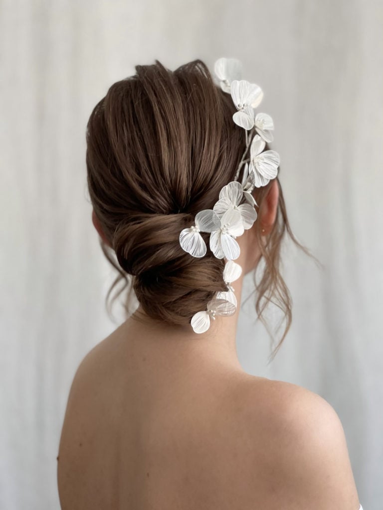 Textured Dark Brown Low Bun Textured Dark Brown Low Bun — Wedding Bun Ideas