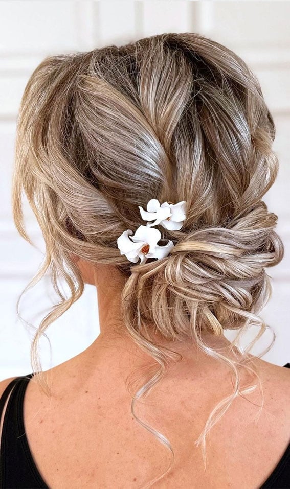 Textured Blonde Updo With Flowers Textured Blonde Updo With Flowers — Wedding Bun Ideas