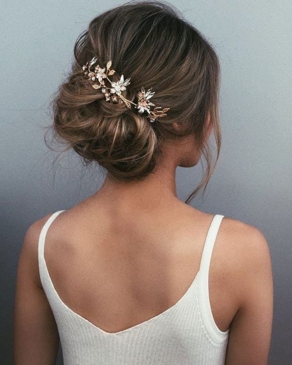 Voluminous Dark Brown Updo With Jeweled Accessory Voluminous Dark Brown Updo With Jeweled Accessory — Wedding Bun Ideas