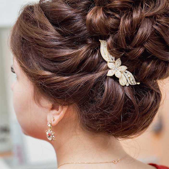 Intricate Dark Brown Updo With Ornate Accessory Intricate Dark Brown Updo With Ornate Accessory — Wedding Bun Ideas