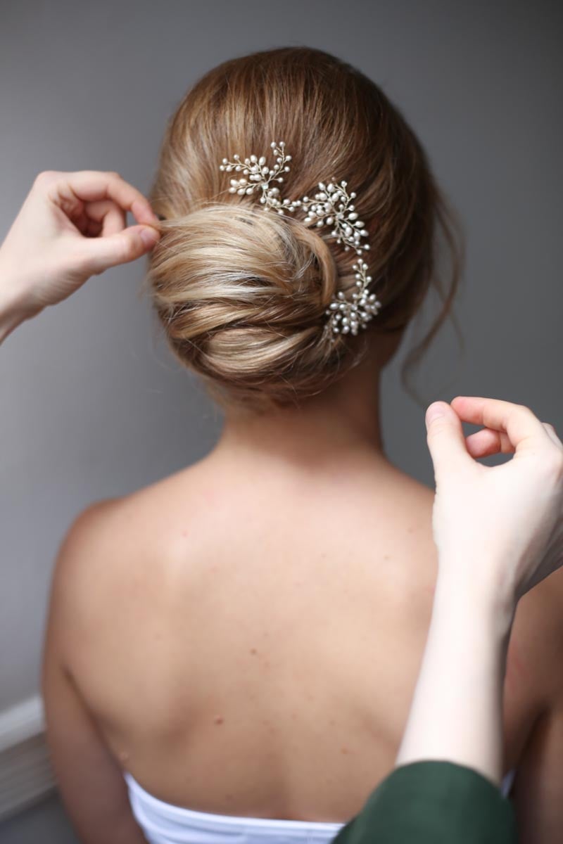 Low Dark Brown Bun With Braided Accent Low Dark Brown Bun With Braided Accent — Wedding Bun Ideas