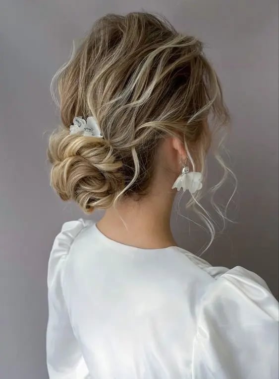 Textured Blonde Bun With Face-Framing Tendrils Textured Blonde Bun With Face-Framing Tendrils — Wedding Bun Ideas